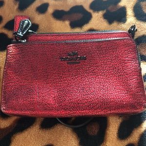 Adorable black and red coach wristlet.